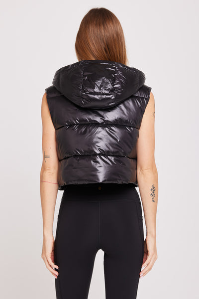 Black Long Puffer Vest With Hood by Metamorphoza