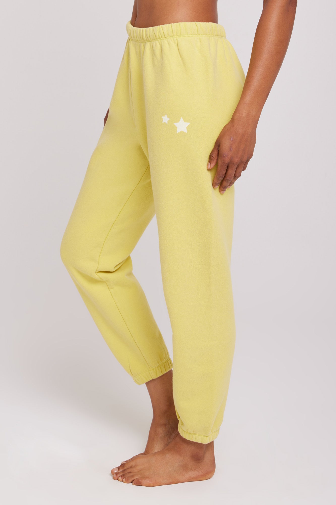 Yellow sweatpants store with stars